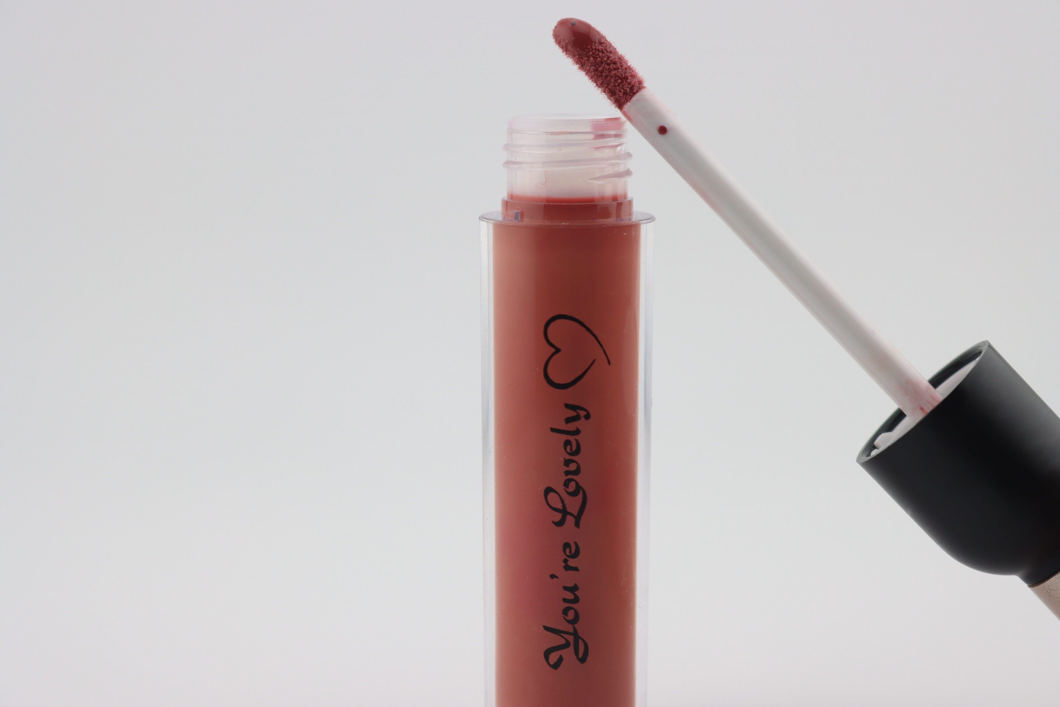 Rude brown Gloss (mixture of pink and brown )